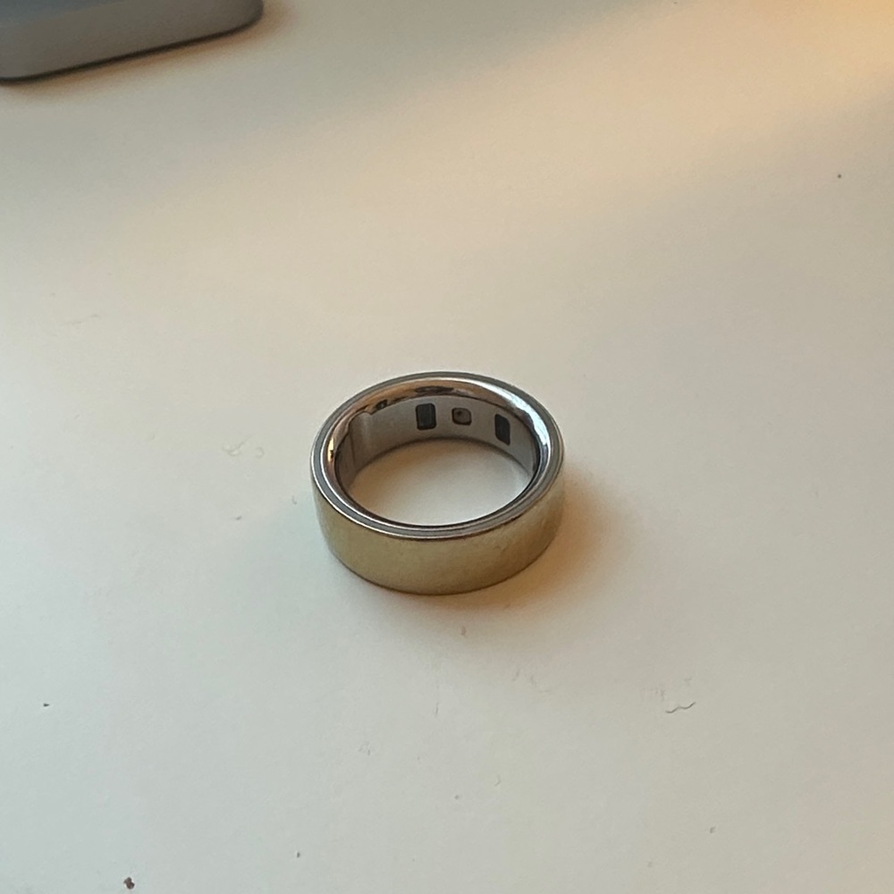 Gold Oura ring health tracker
